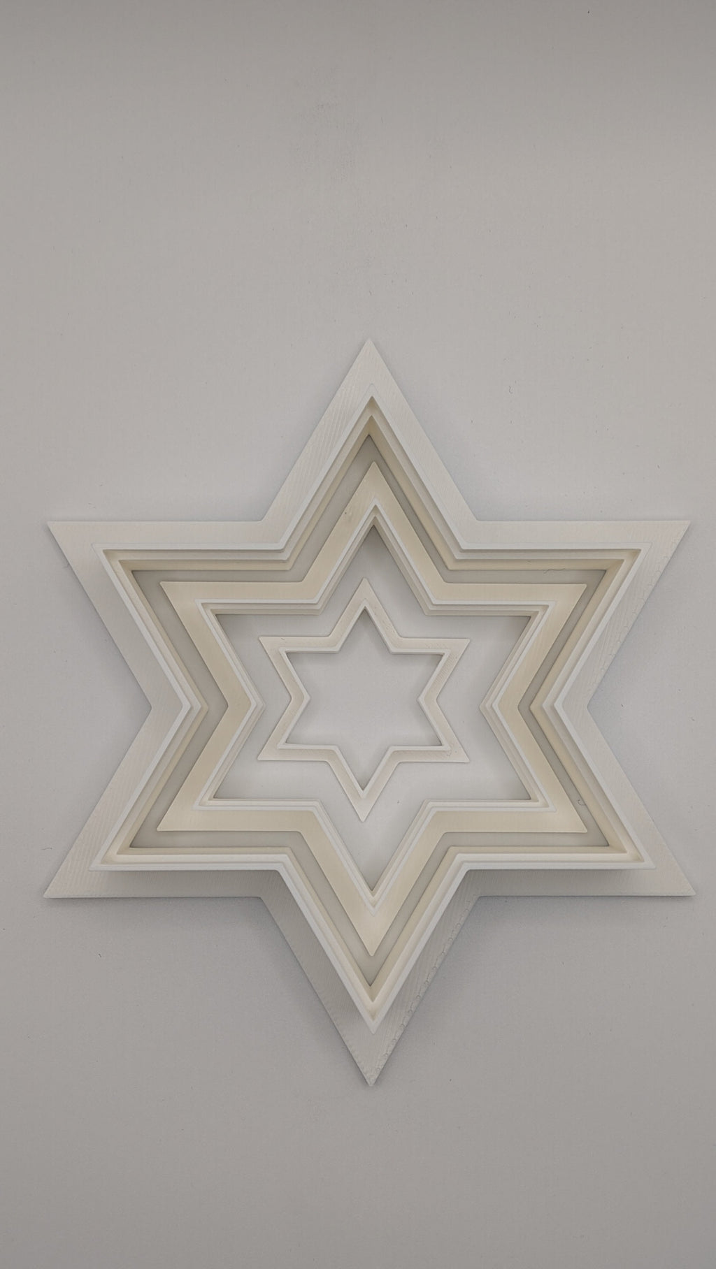 Close-up of a Star of David cookie cutter showing the sharp cutting edge